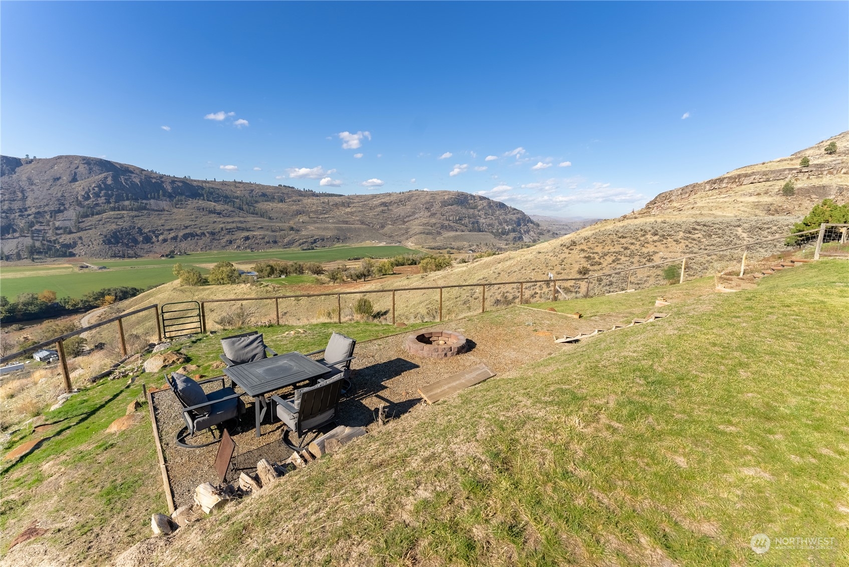 369 Tunk Creek Road Riverside, WA 98849 - Photo 18 of 40 a view of a terrace with wooden floor and lake view
