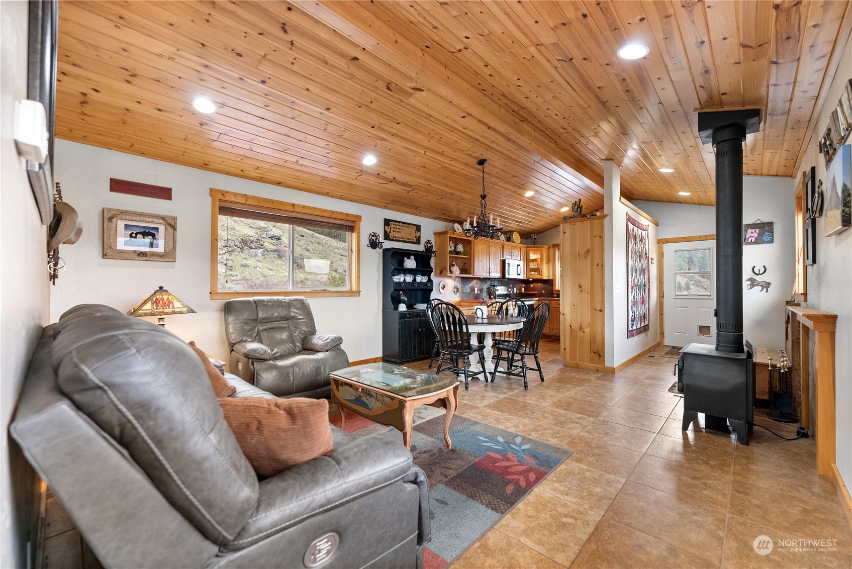 369 Tunk Creek Road Riverside, WA 98849 - Photo 23 of 40 a living room with furniture and a large window