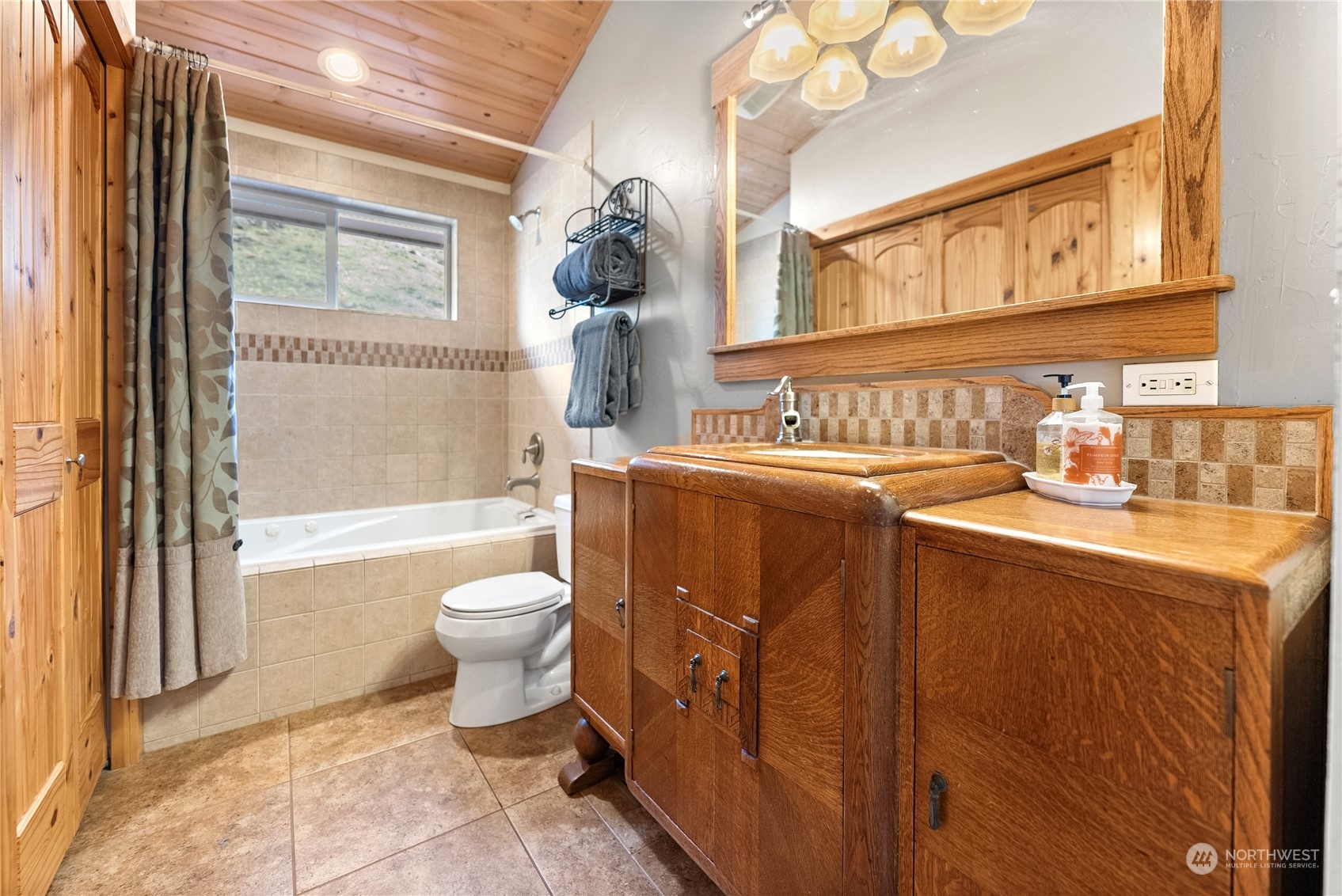 369 Tunk Creek Road Riverside, WA 98849 - Photo 26 of 40 a bathroom with a sink a toilet and shower