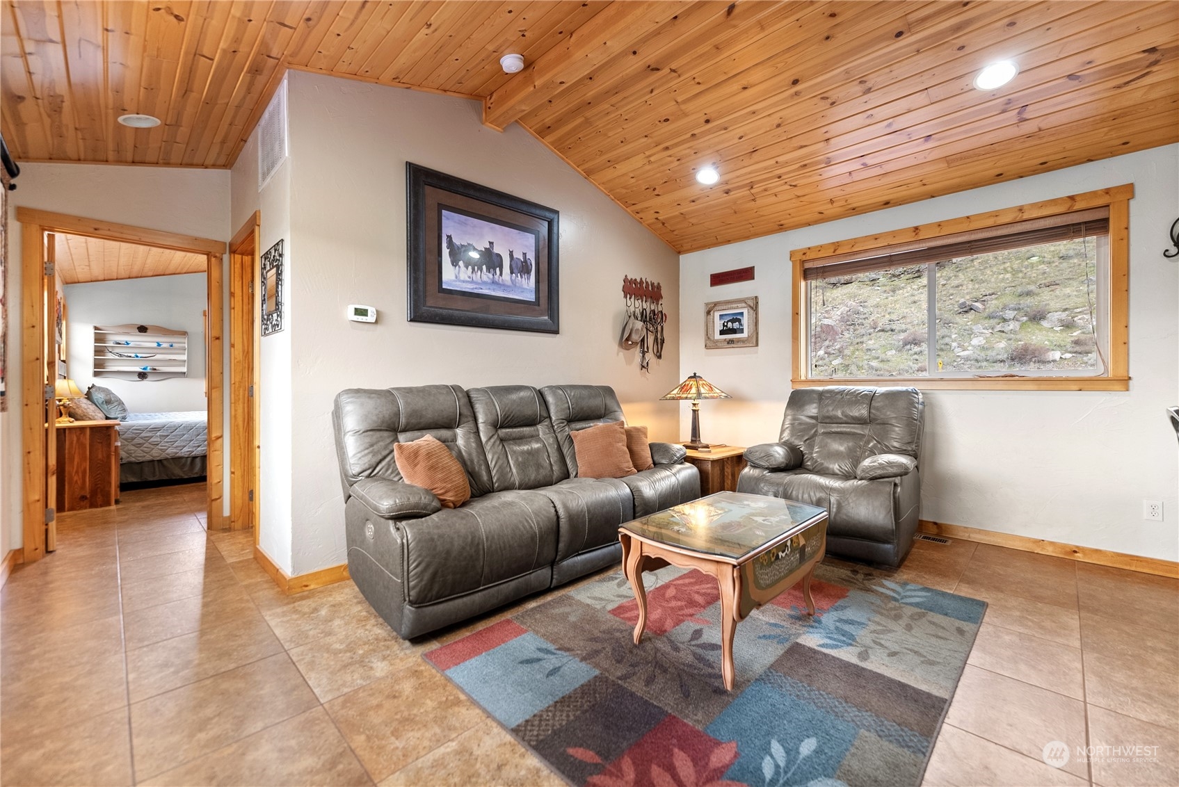369 Tunk Creek Road Riverside, WA 98849 - Photo 29 of 40 a living room with furniture and a large window