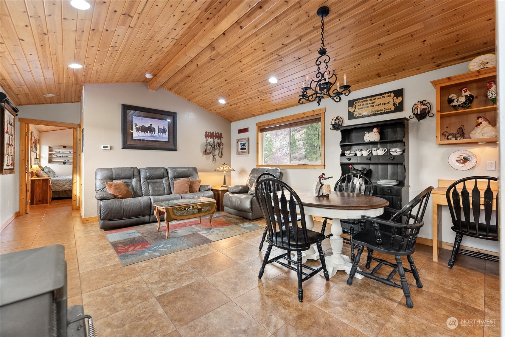 369 Tunk Creek Road Riverside, WA 98849 - Photo 32 of 40 a living room with furniture kitchen view and a wooden floor