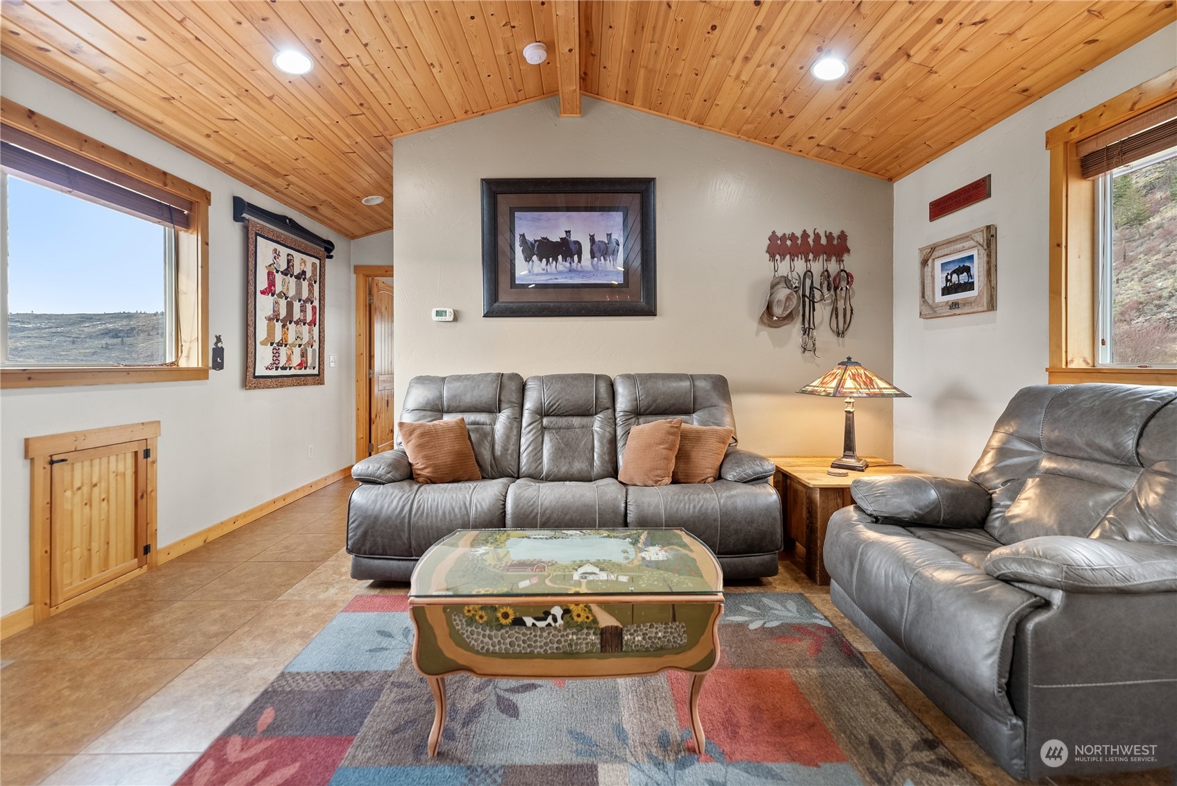 369 Tunk Creek Road Riverside, WA 98849 - Photo 33 of 40 a living room with furniture and a wooden floor