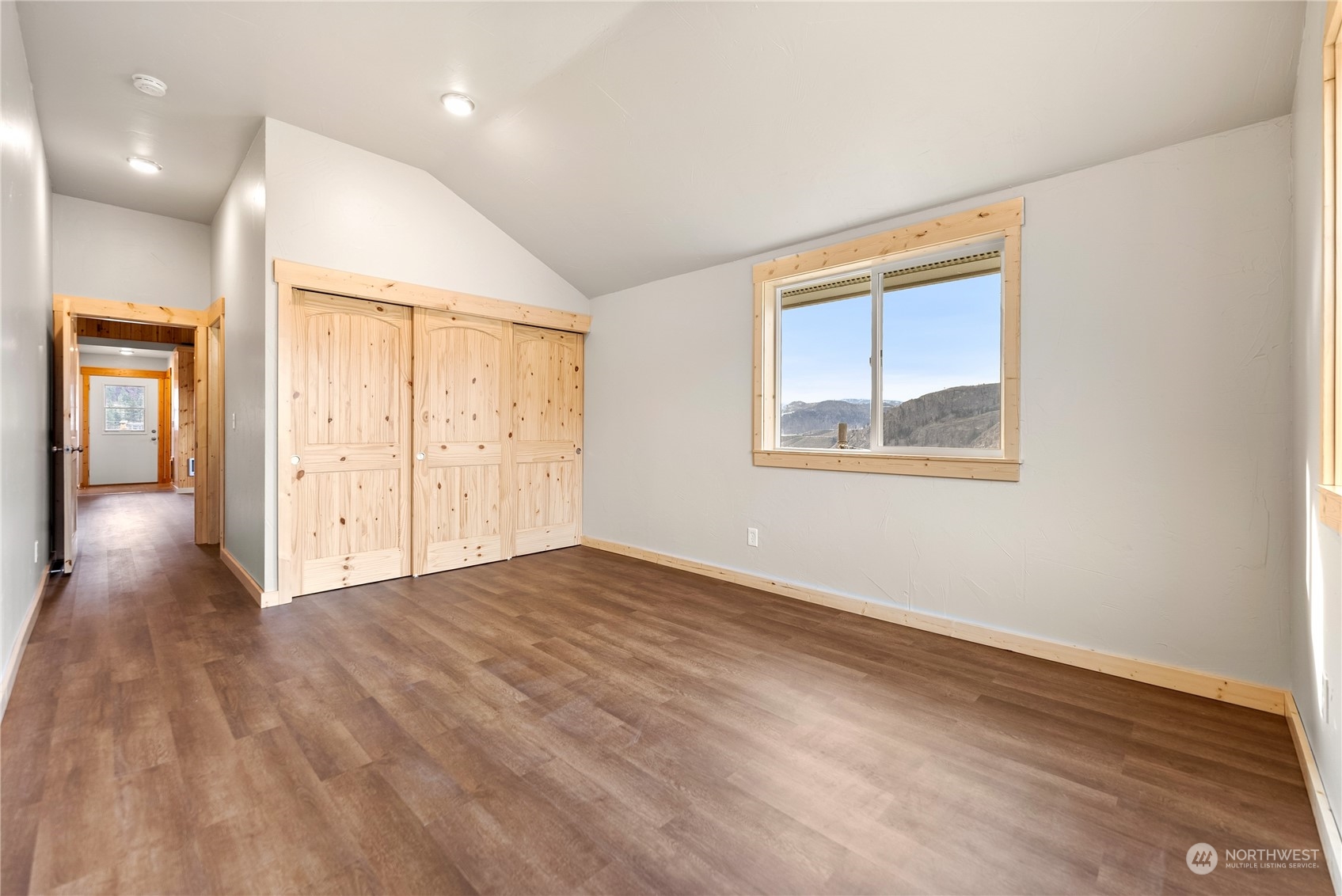 369 Tunk Creek Road Riverside, WA 98849 - Photo 36 of 40 an empty room with wooden floor and windows