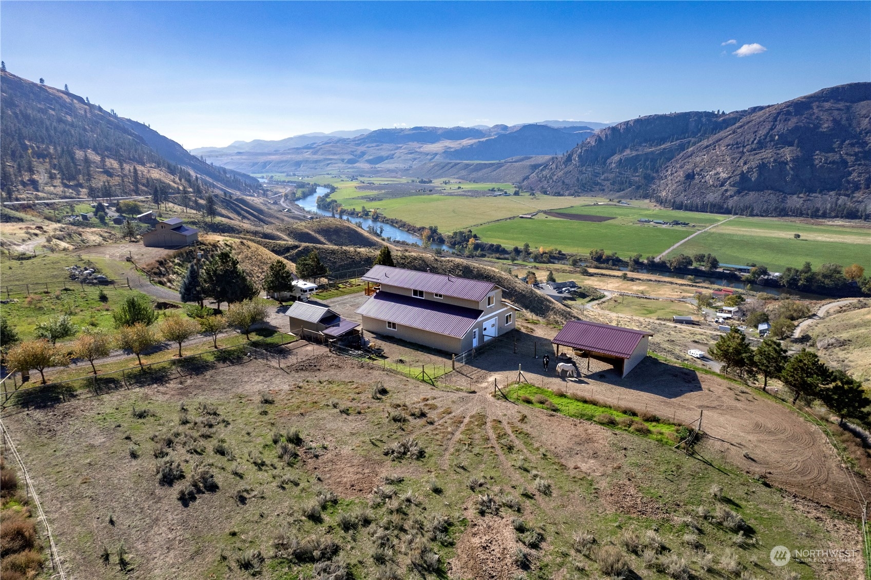 369 Tunk Creek Road Riverside, WA 98849 - Photo 6 of 40 a view of a lush green hillside and houses