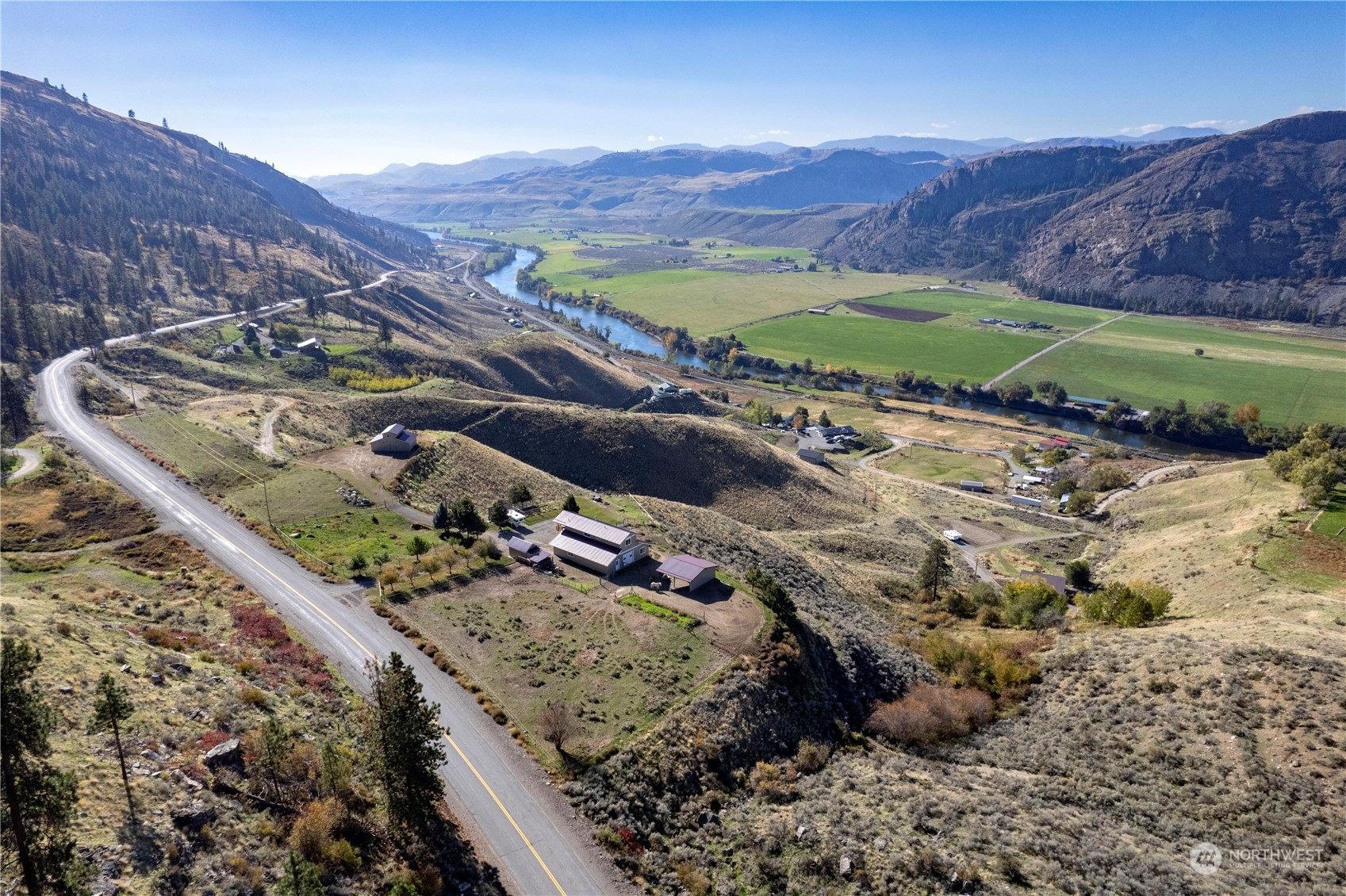 369 Tunk Creek Road Riverside, WA 98849 - Photo 7 of 40 a view of a lush green hillside and a mountain view