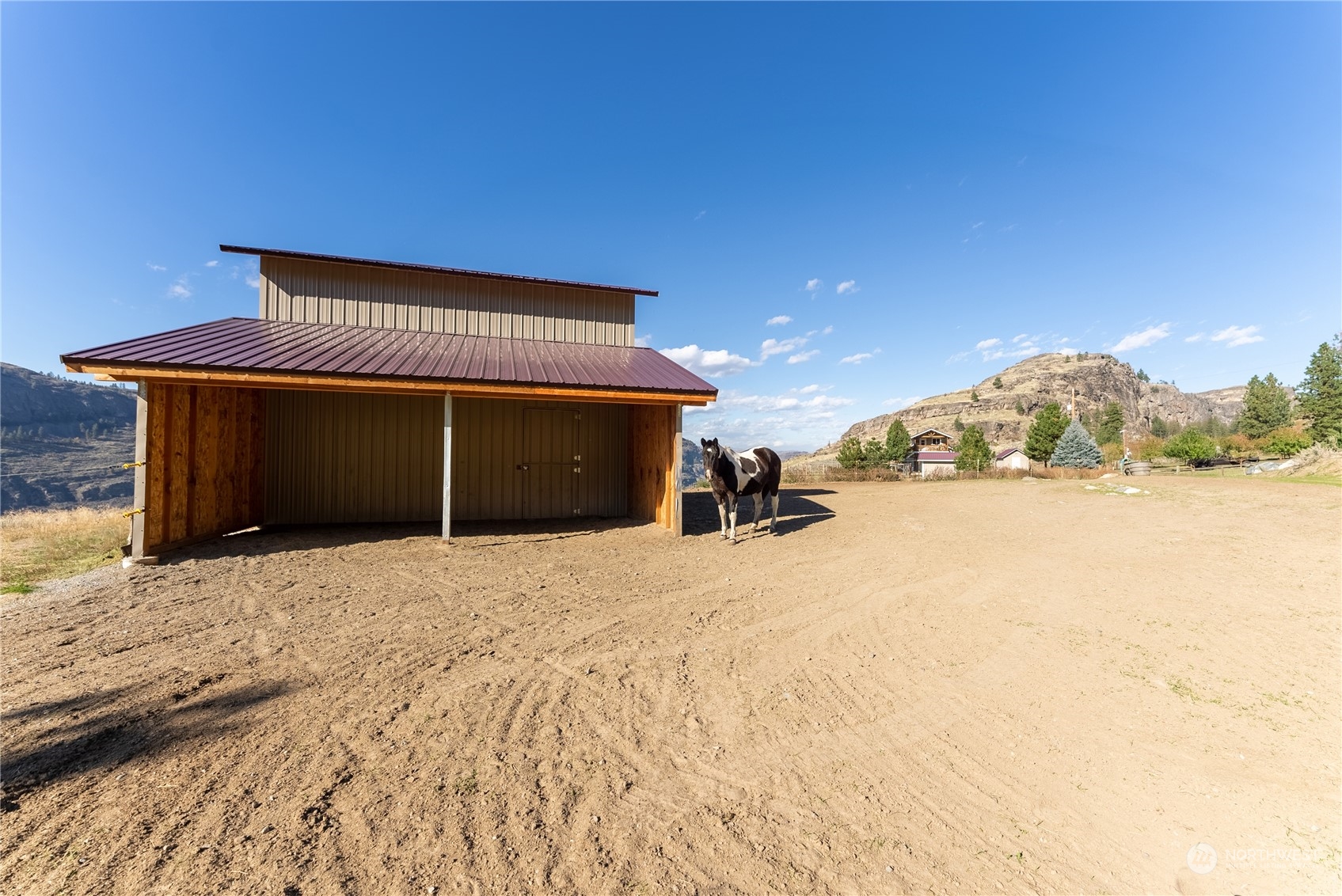 369 Tunk Creek Road Riverside, WA 98849 - Photo 10 of 40 a view of a house with a yard