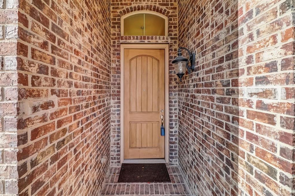 205 Mineral Point Drive Aledo, TX 76008 - Photo 5 of 38 a view of a wooden door with a door