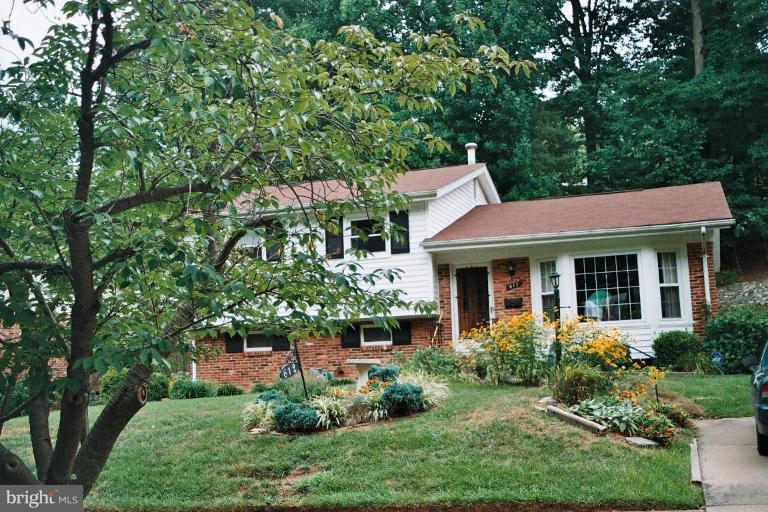 612 Kenbrook Drive Silver Spring, MD 20902 - Photo 1 of 11 a view of a house with a yard and potted plants