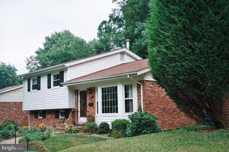 612 Kenbrook Drive Silver Spring, MD 20902 - Photo 11 of 11 a front view of a house with garden