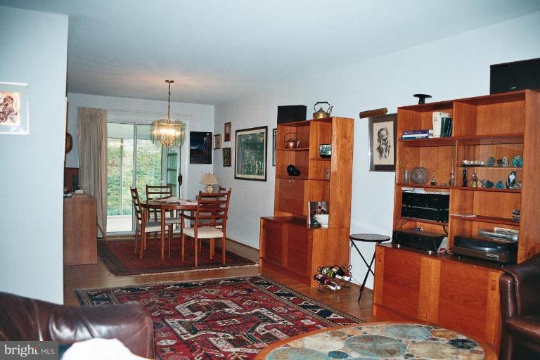 612 Kenbrook Drive Silver Spring, MD 20902 - Photo 6 of 11 a living room with furniture and a chandelier