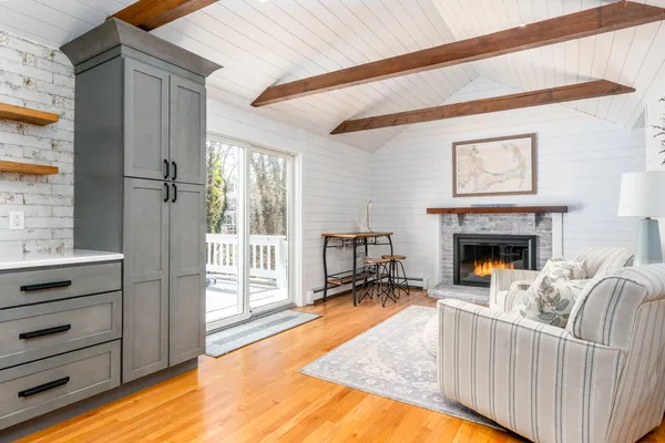 a view of a room with a fireplace and cabinet