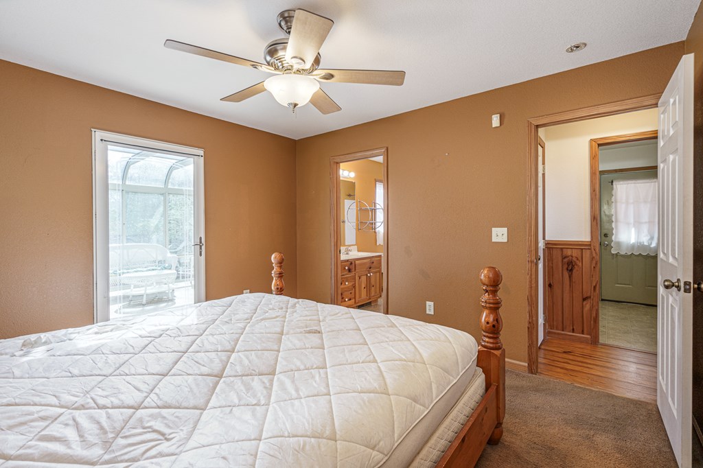 41 Carvers Vw Trail Murphy, NC 28906 - Photo 14 of 46 a bedroom with a large bed and a chandelier