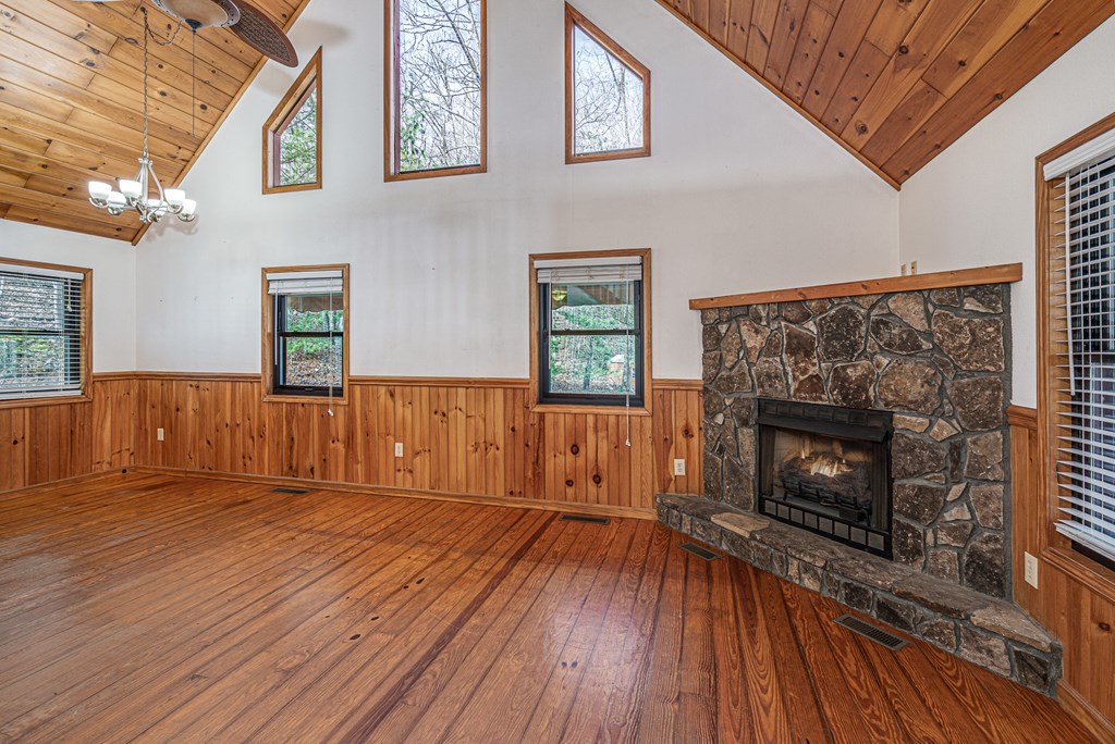 41 Carvers Vw Trail Murphy, NC 28906 - Photo 7 of 46 a view of a livingroom with wooden floor and a fireplace