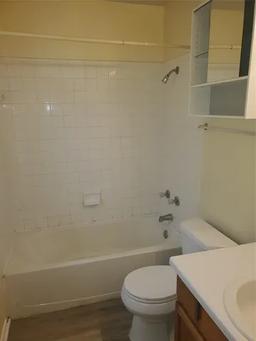 a view of a bathroom with a sink and a mirror
