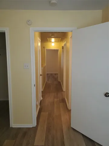 a view of backyard with wooden fence