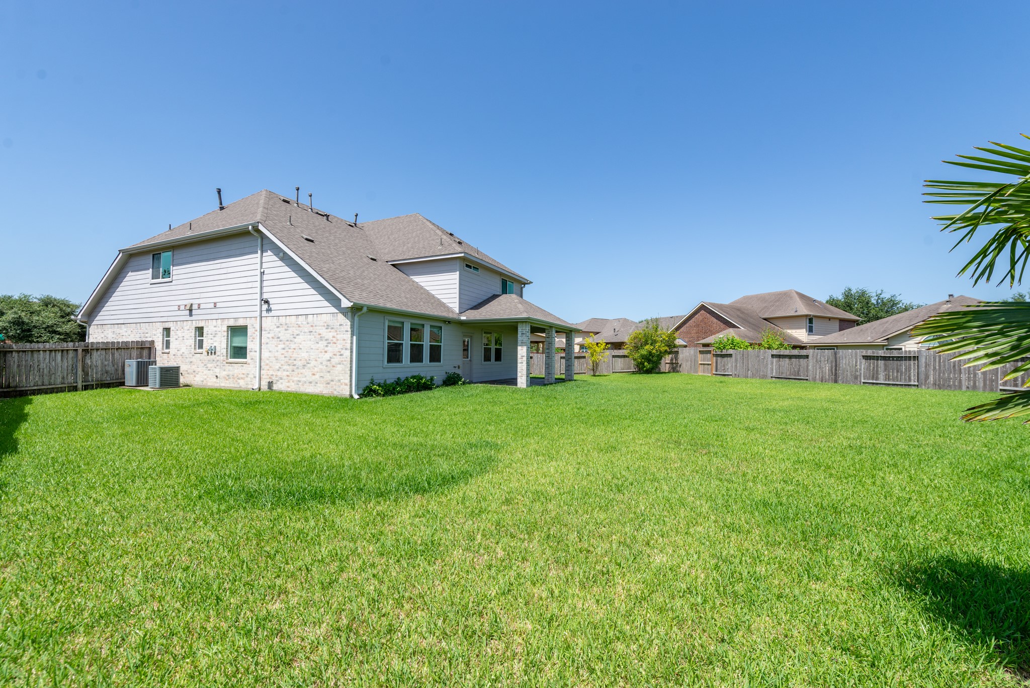 26302 Fox Ridge Lane Katy, TX 77494 - Photo 5 of 35 Oversized backyard, perfect for outdoor activities and entertaining, complemented by with a covered patio.