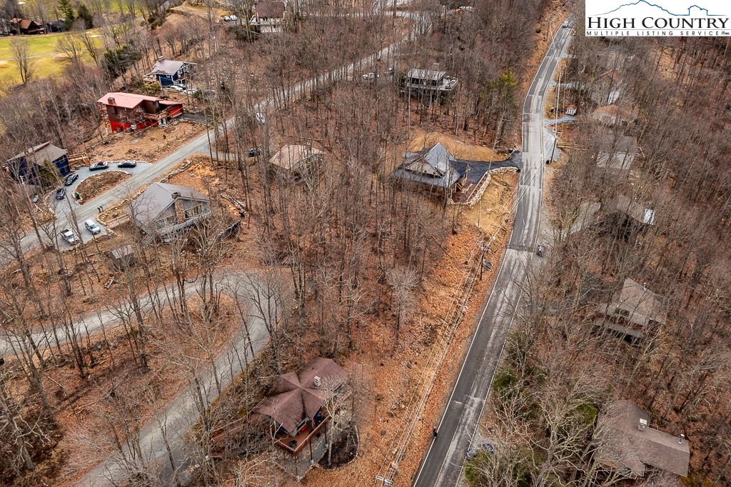 131 Club House Road Beech Mountain, NC 28604 - Photo 2 of 14 a view of residential house with parking space
