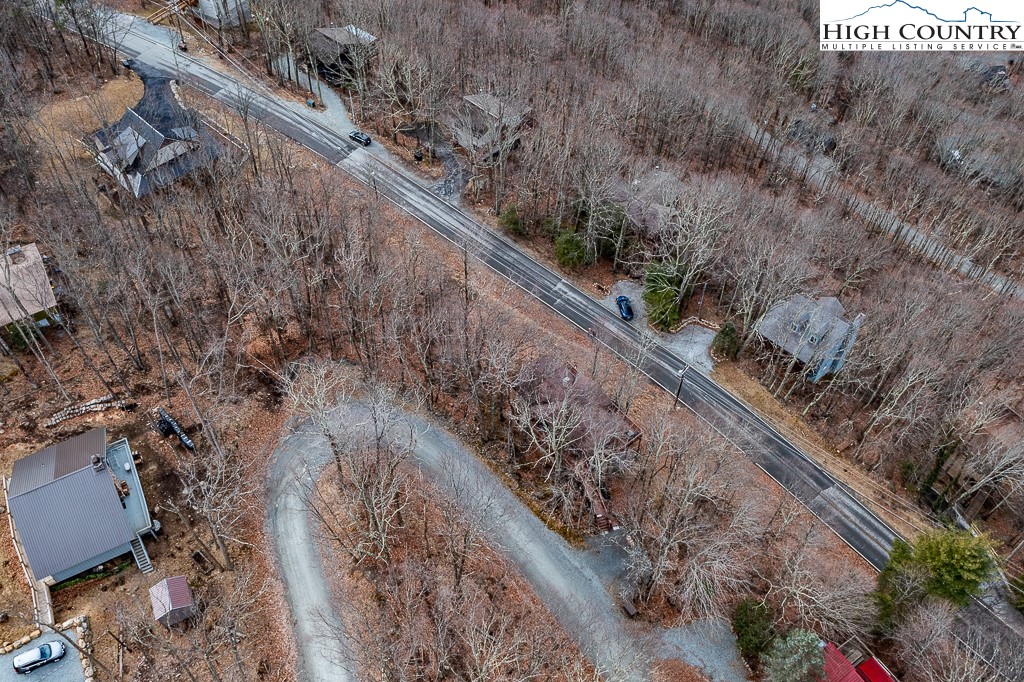131 Club House Road Beech Mountain, NC 28604 - Photo 4 of 14 a view of a yard with wooden fence