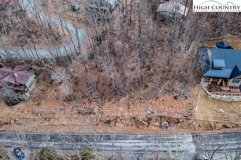131 Club House Road Beech Mountain, NC 28604 - Photo 5 of 14 a view of a yard with an outdoor space