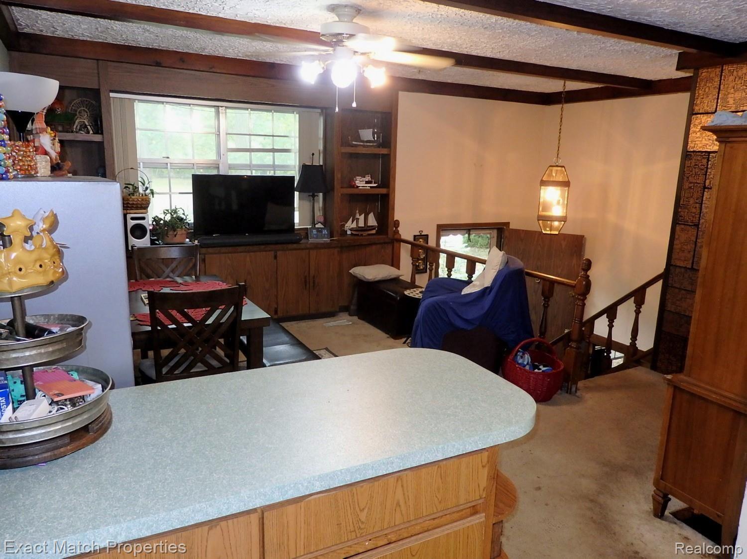 1392 Delta Road Walled Lake, MI 48390 - Photo 31 of 48 Snack bar overlooks living room