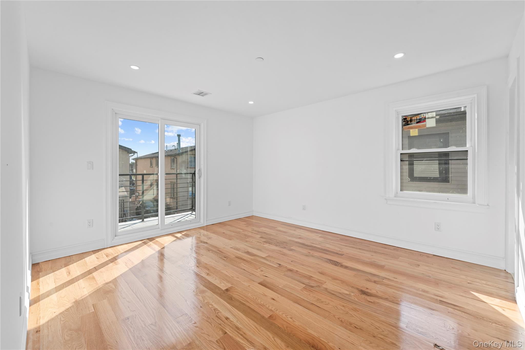 258-14 147th Road Queens, NY 11422 - Photo 15 of 22 Unfurnished room featuring light wood-style floors and recessed lighting