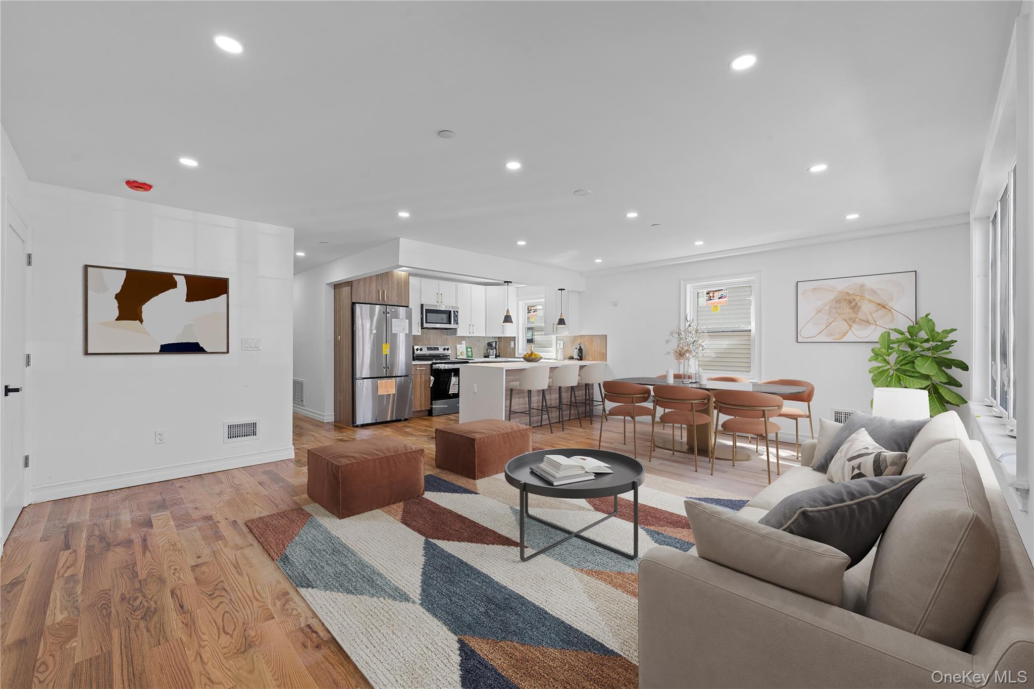 258-14 147th Road Queens, NY 11422 - Photo 3 of 22 Living room with light wood-style floors and recessed lighting