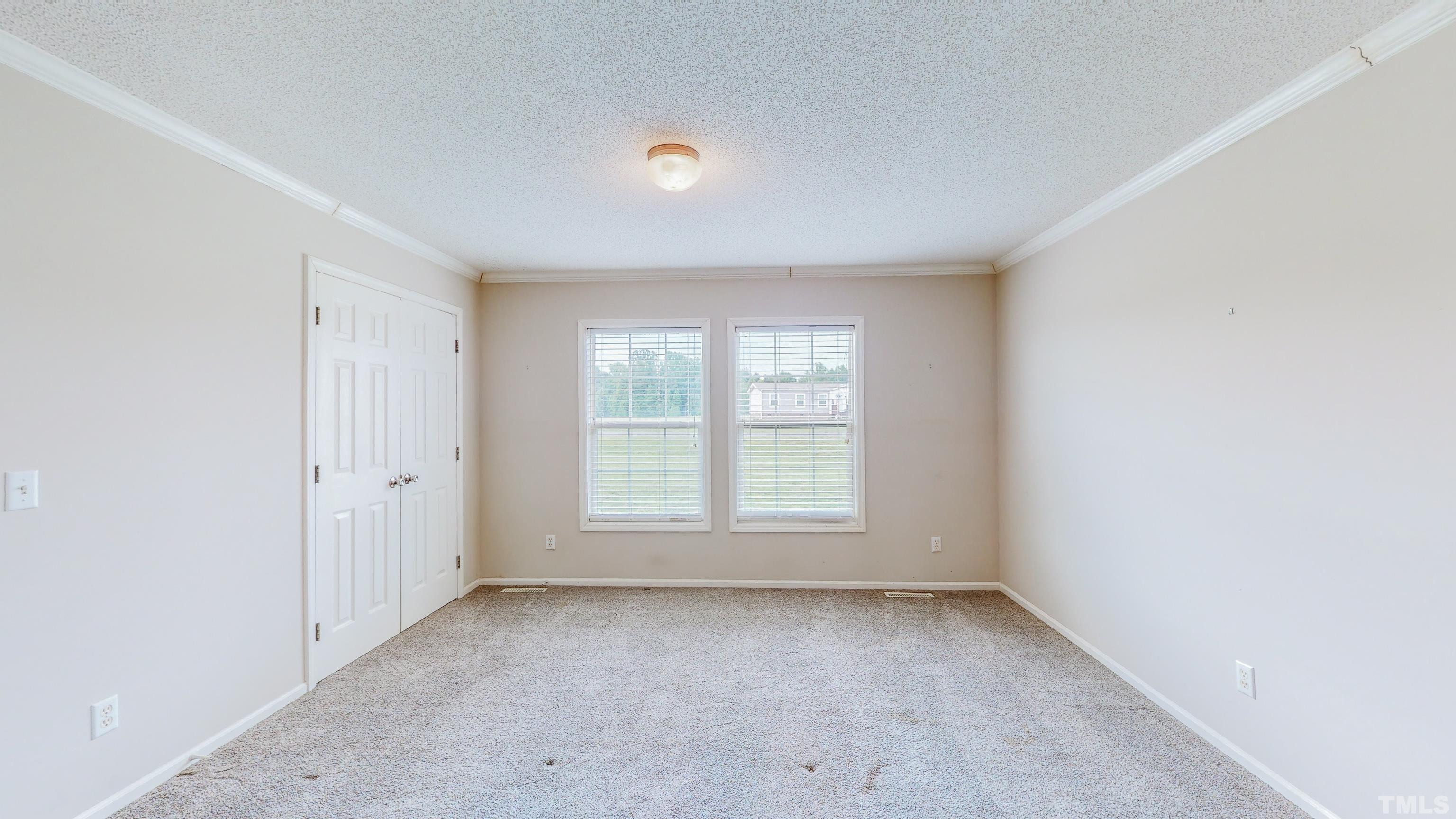 147 Quartergate Road Roxboro, NC 27574 - Photo 13 of 30 an empty room with a window
