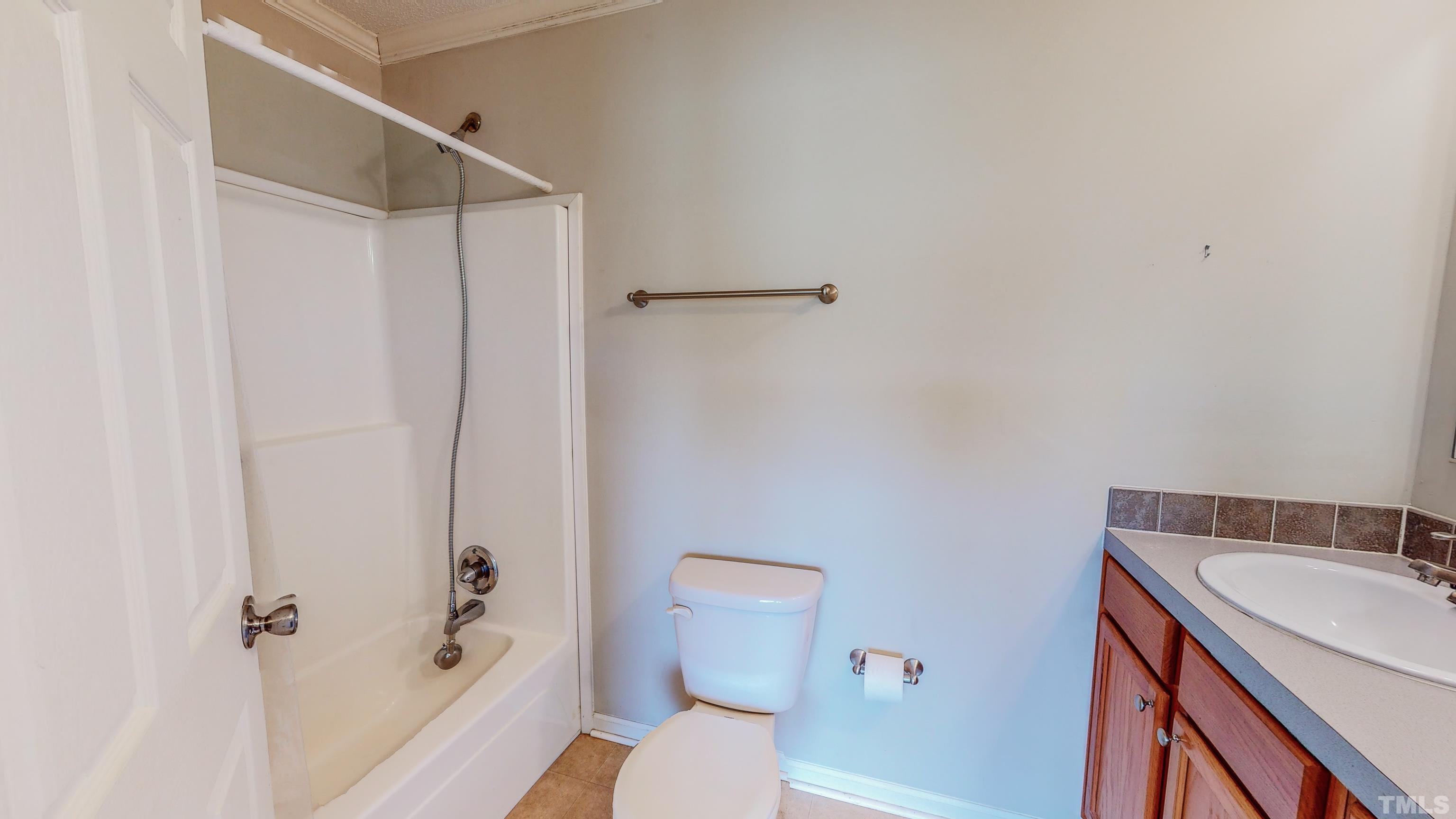 147 Quartergate Road Roxboro, NC 27574 - Photo 15 of 30 a bathroom with a sink a toilet and shower