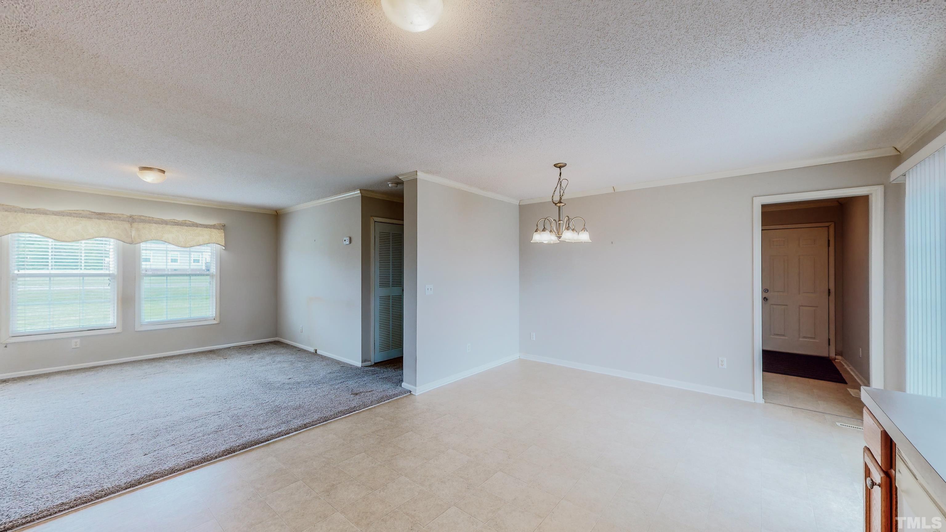 147 Quartergate Road Roxboro, NC 27574 - Photo 18 of 30 an empty room with a empty space and windows