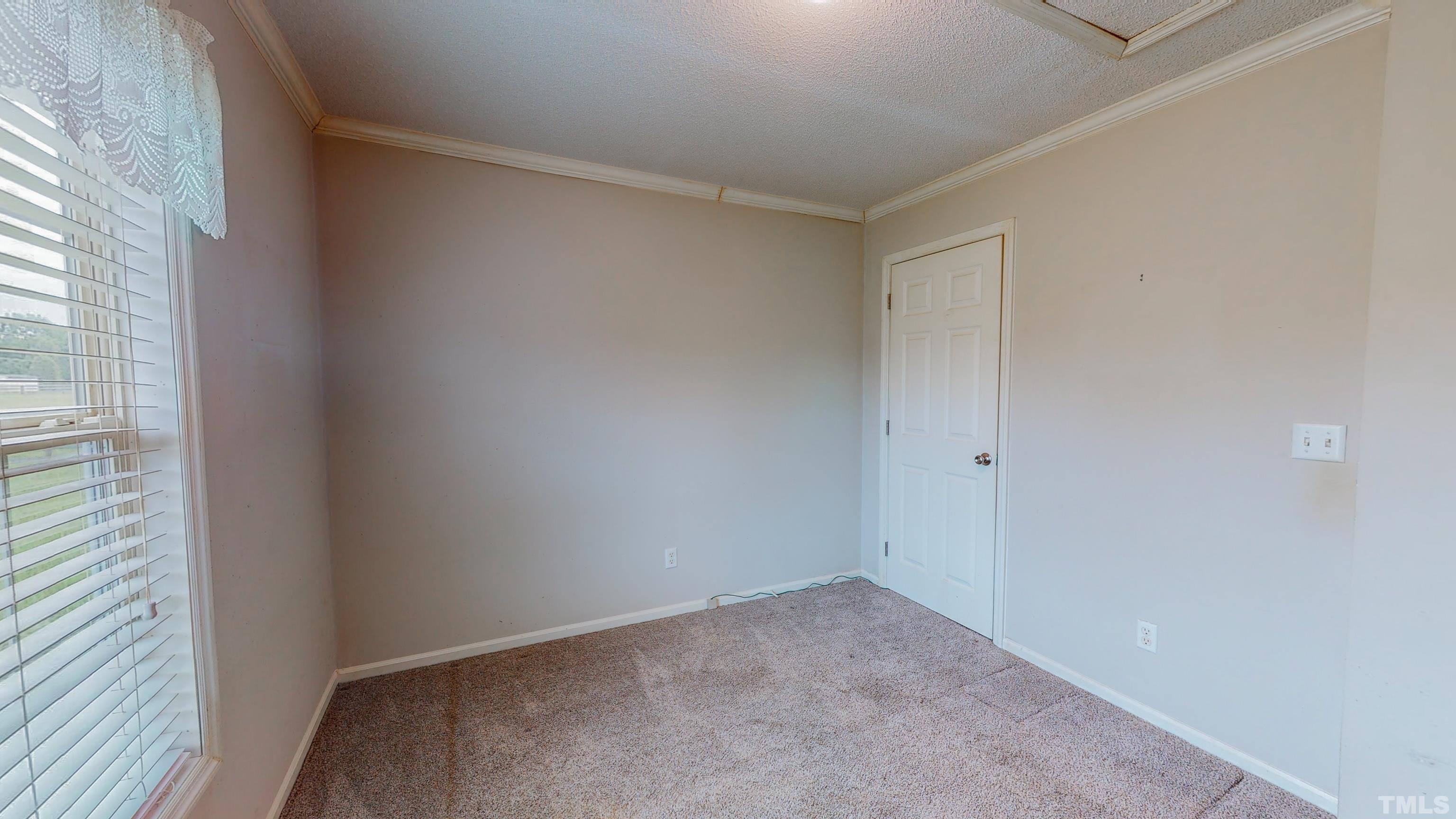 147 Quartergate Road Roxboro, NC 27574 - Photo 23 of 30 a view of an empty room and window