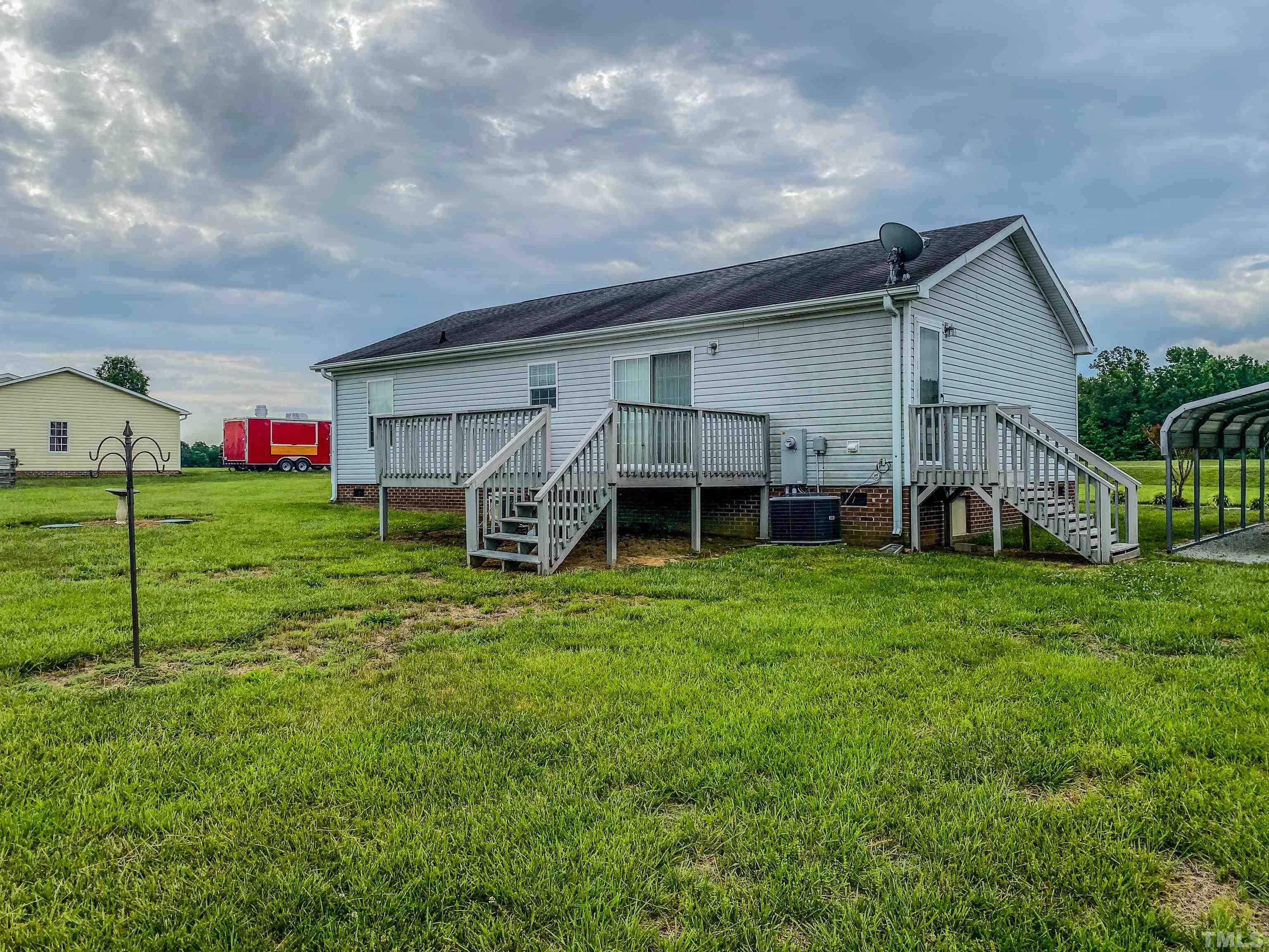 147 Quartergate Road Roxboro, NC 27574 - Photo 27 of 30 a view of a house with backyard