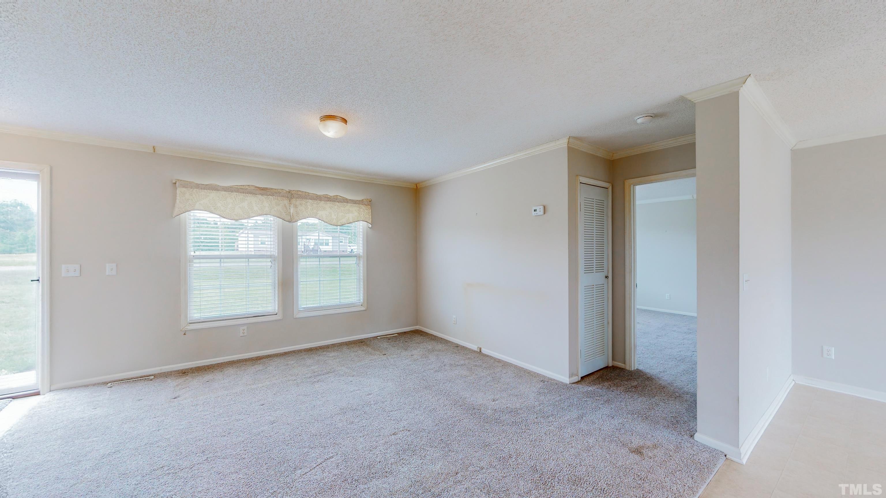 147 Quartergate Road Roxboro, NC 27574 - Photo 9 of 30 a view of an empty room with a window