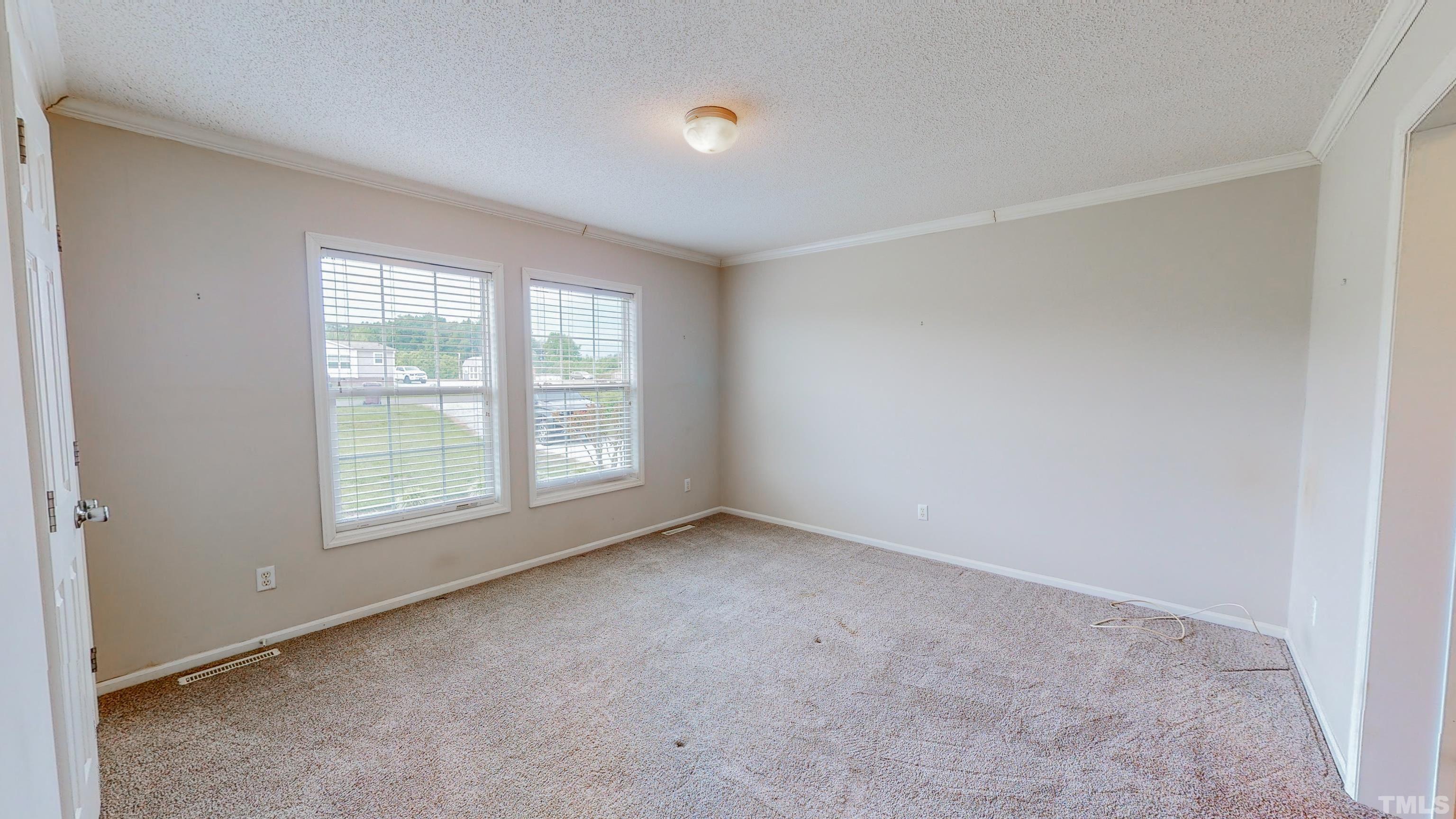 147 Quartergate Road Roxboro, NC 27574 - Photo 10 of 30 an empty room with a window