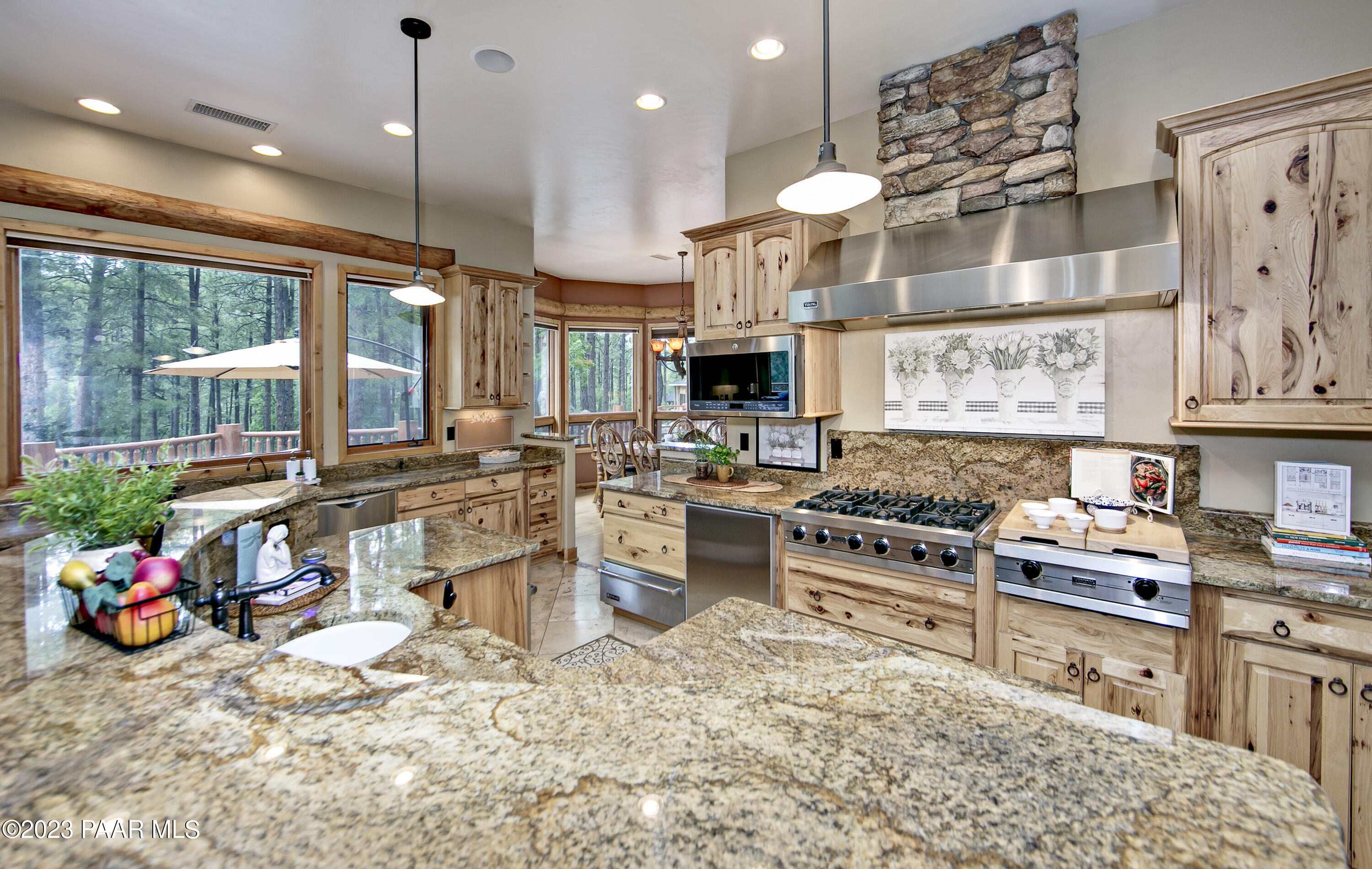 5140 East Charcoal Kiln Road Prescott, AZ 86303 - Photo 14 of 77 a kitchen with lots of counter top space and a sink