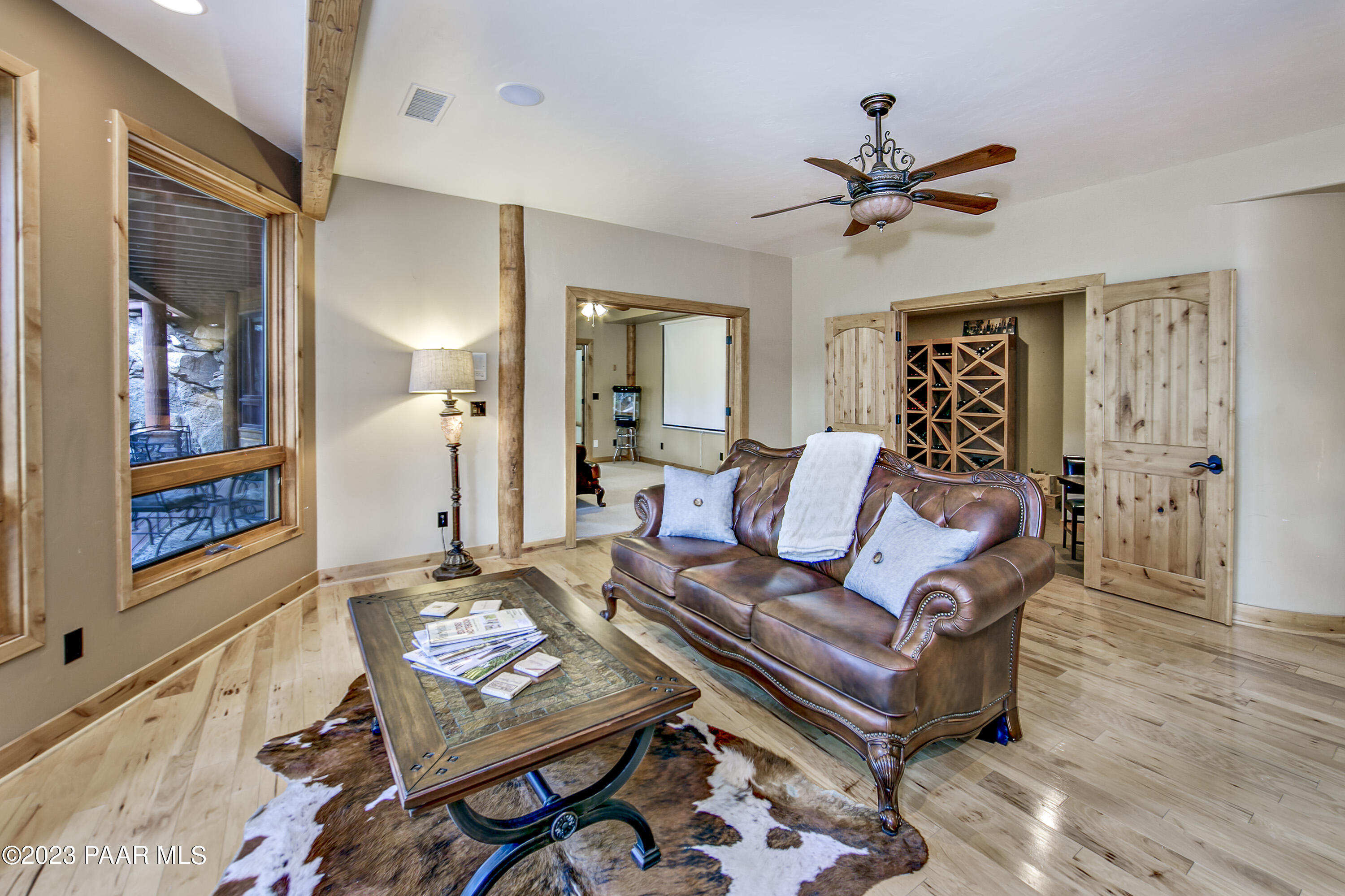 5140 East Charcoal Kiln Road Prescott, AZ 86303 - Photo 29 of 77 a living room with furniture a rug and a window