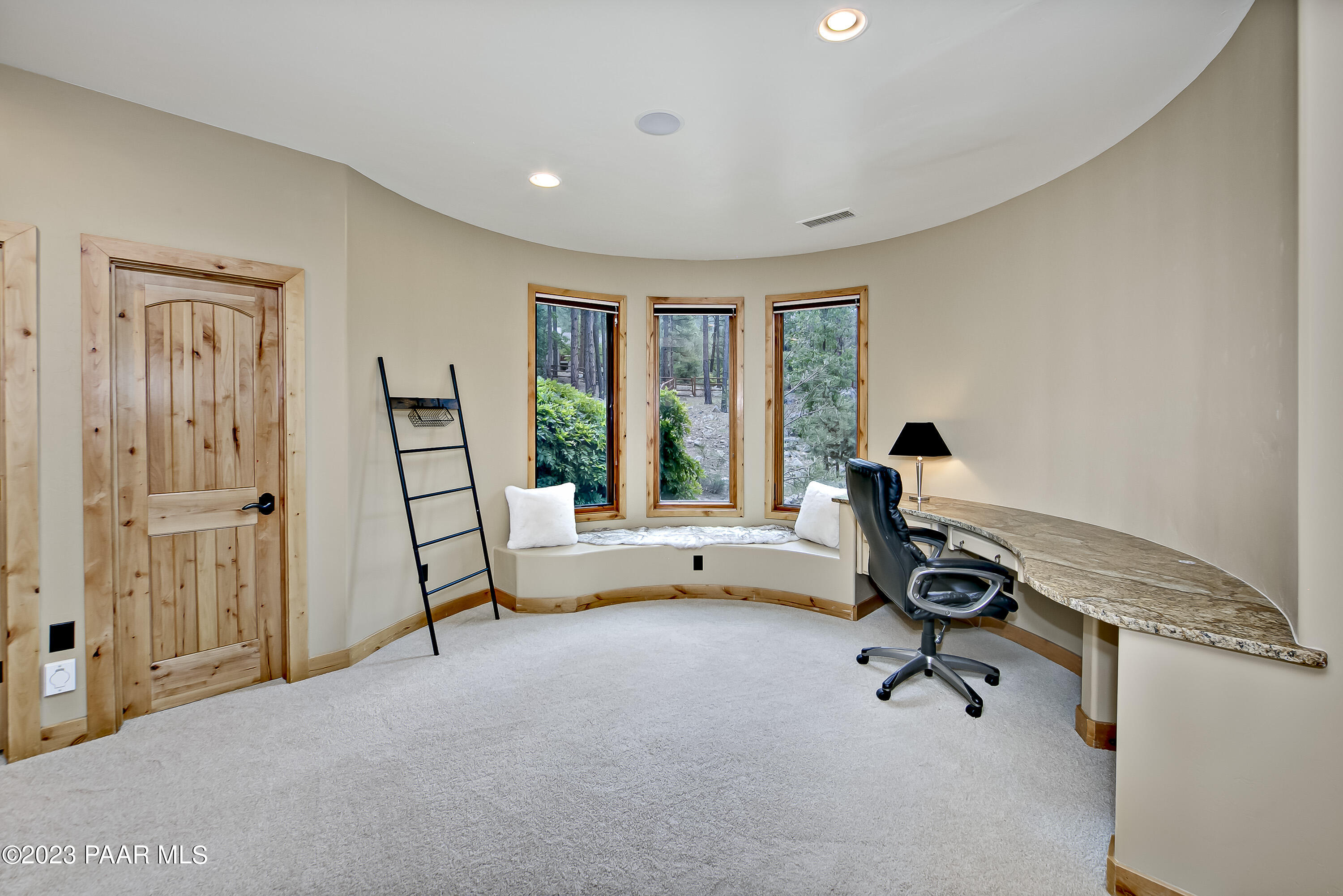5140 East Charcoal Kiln Road Prescott, AZ 86303 - Photo 38 of 77 a view of a livingroom with workspace and a window