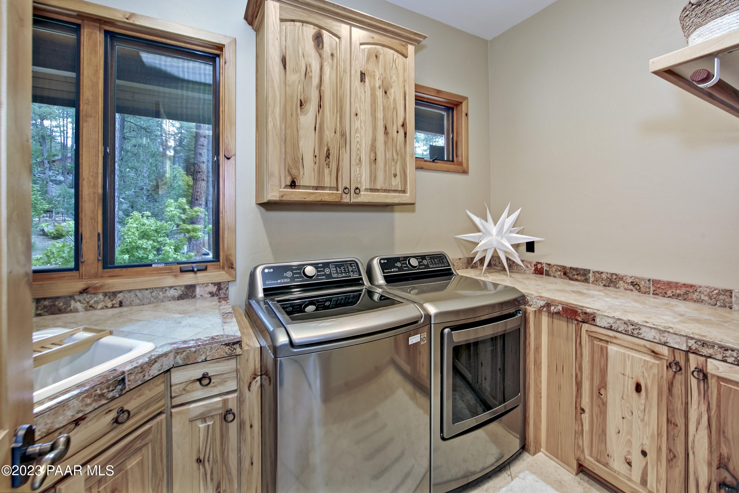 5140 East Charcoal Kiln Road Prescott, AZ 86303 - Photo 42 of 77 a kitchen with a stove and a sink