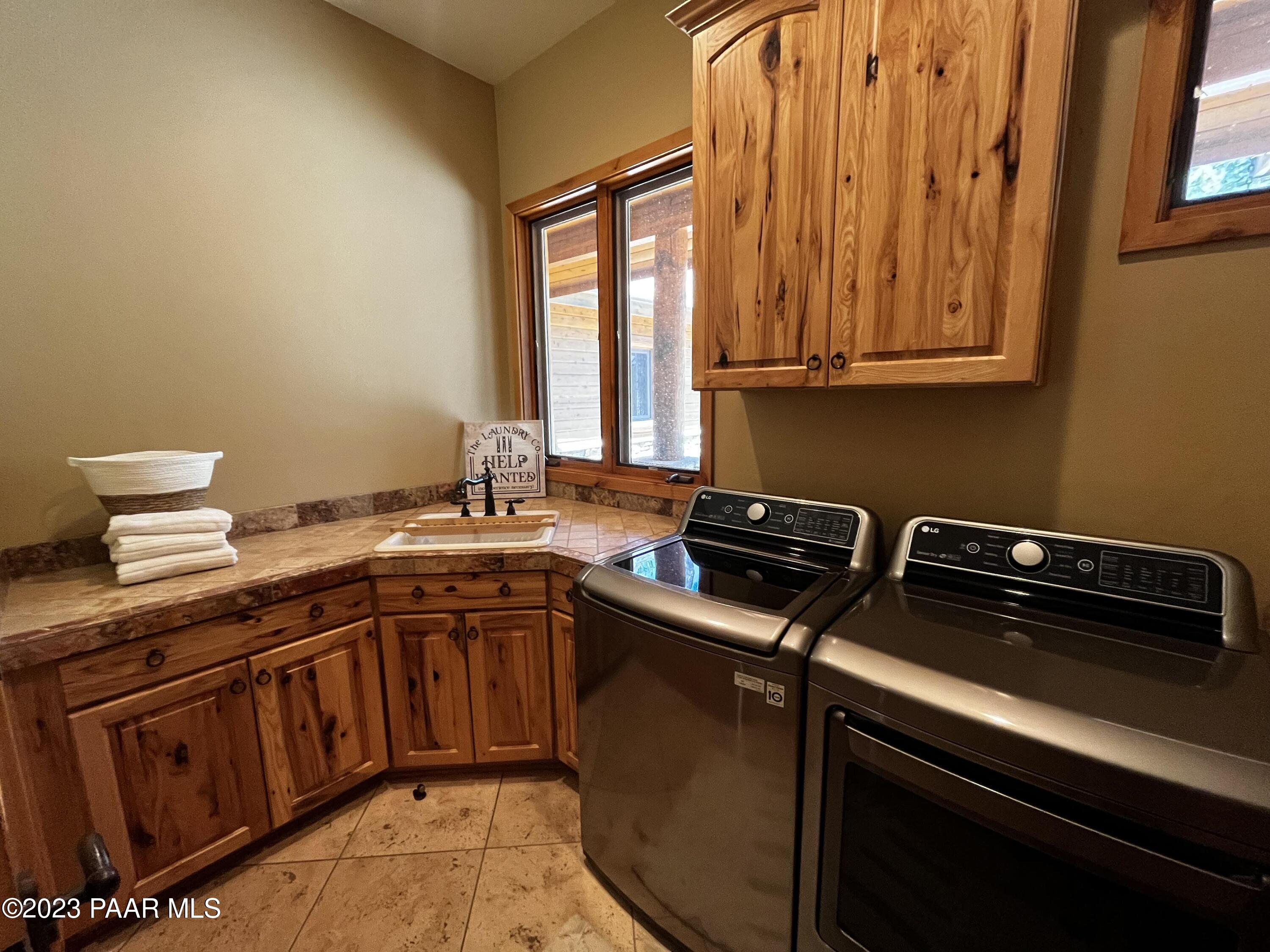 5140 East Charcoal Kiln Road Prescott, AZ 86303 - Photo 43 of 77 a kitchen with stainless steel appliances granite countertop a sink stove and cabinets
