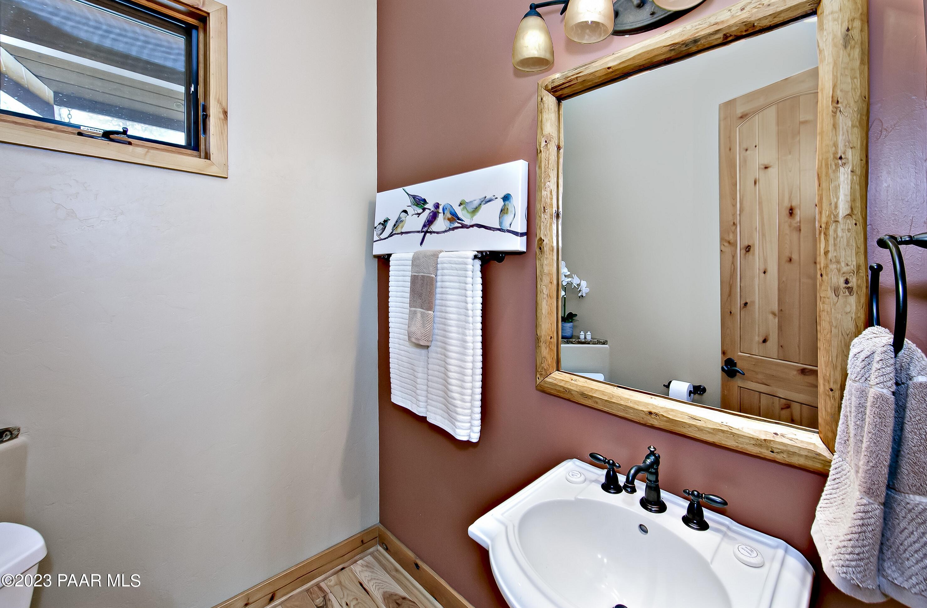 5140 East Charcoal Kiln Road Prescott, AZ 86303 - Photo 44 of 77 a bathroom with a sink and a mirror