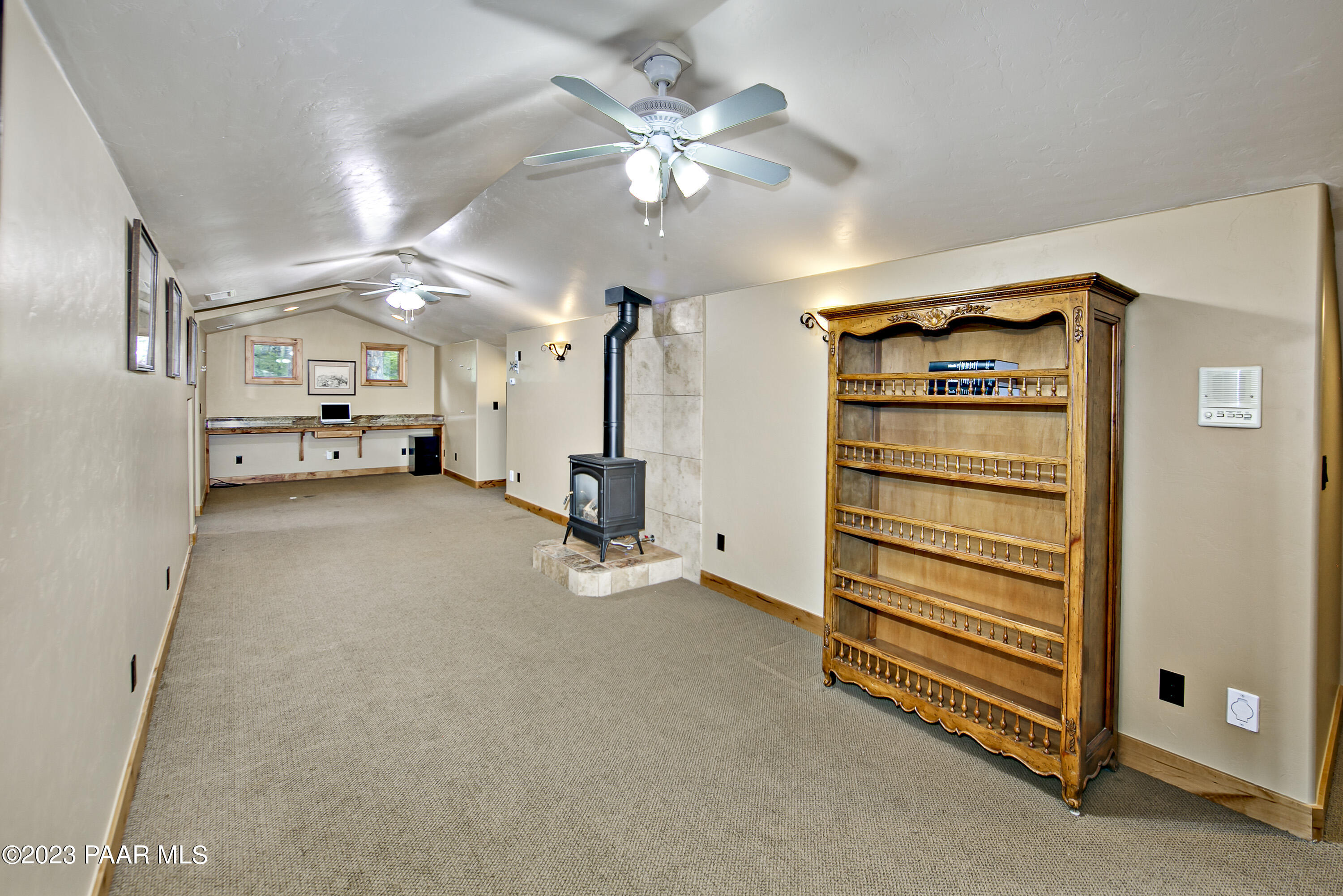 5140 East Charcoal Kiln Road Prescott, AZ 86303 - Photo 45 of 77 a view of an empty room and a ceiling fan
