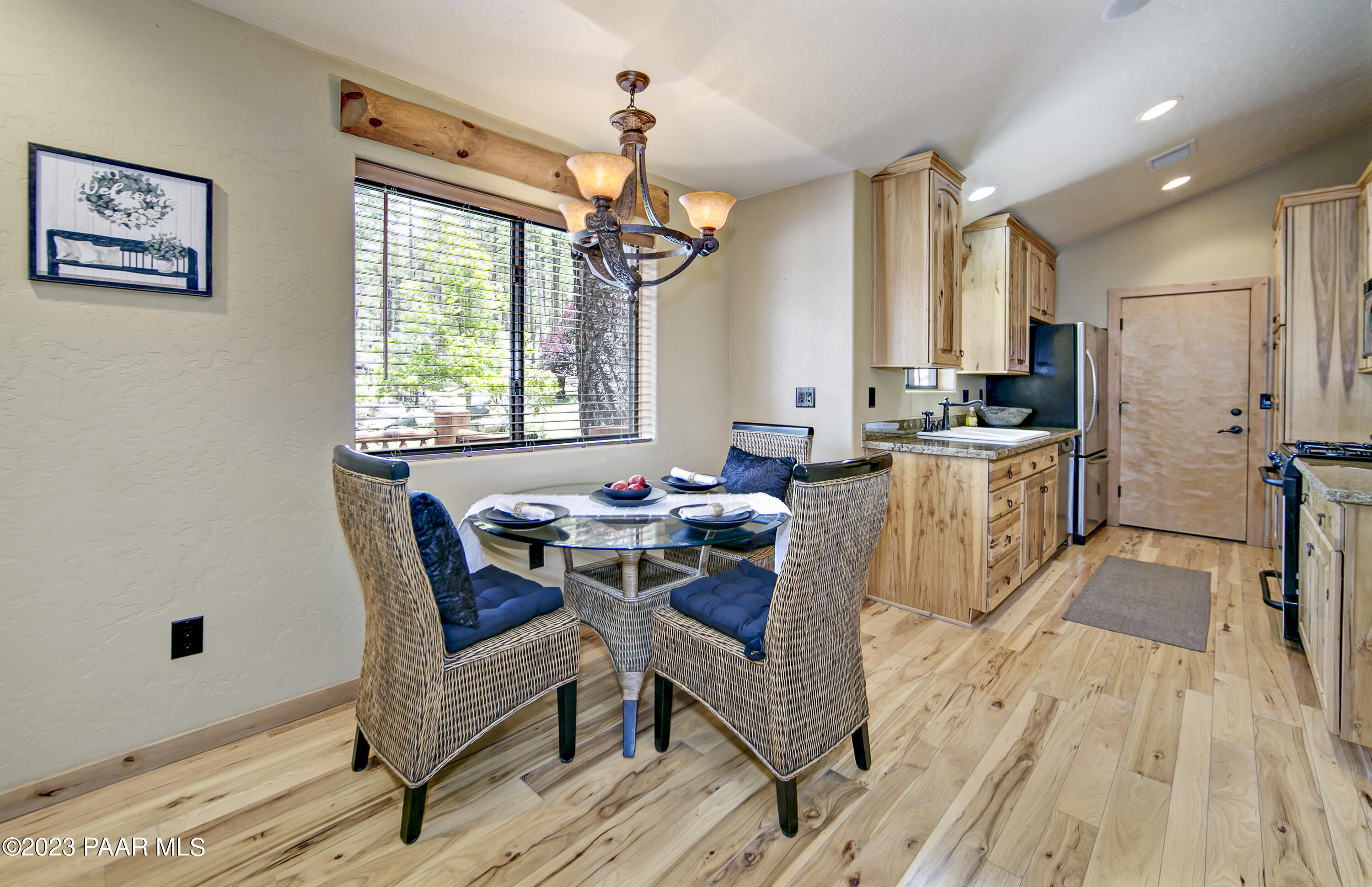 5140 East Charcoal Kiln Road Prescott, AZ 86303 - Photo 65 of 77 a view of a dining room with furniture window and wooden floor