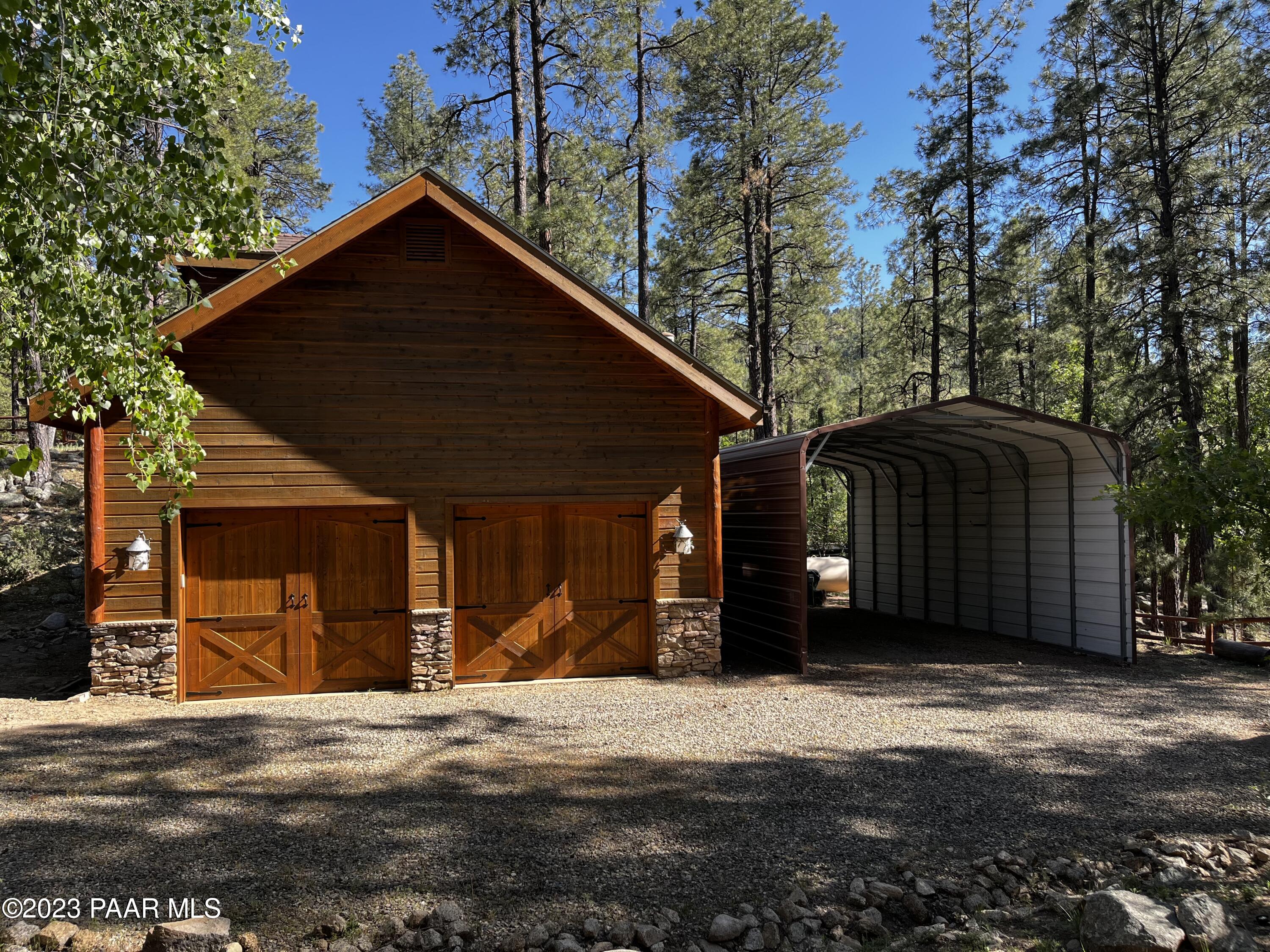 5140 East Charcoal Kiln Road Prescott, AZ 86303 - Photo 69 of 77 a front view of a house with a yard