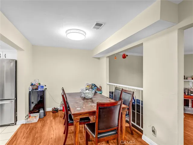 a dining room with furniture and a window