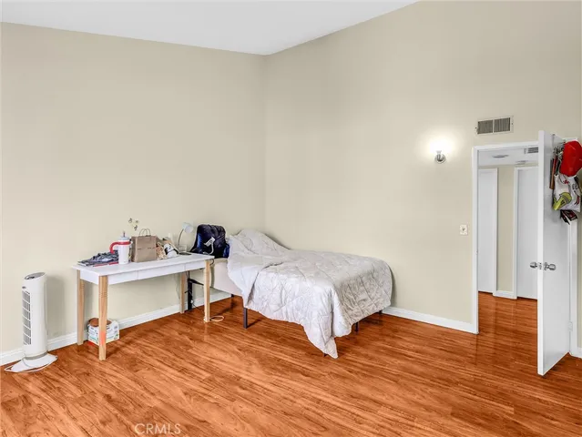 a bedroom with a bed and a table