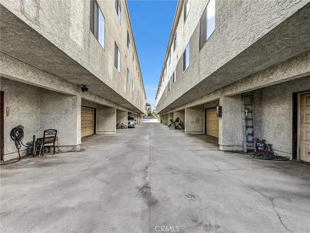 a view of a house with patio and a yard