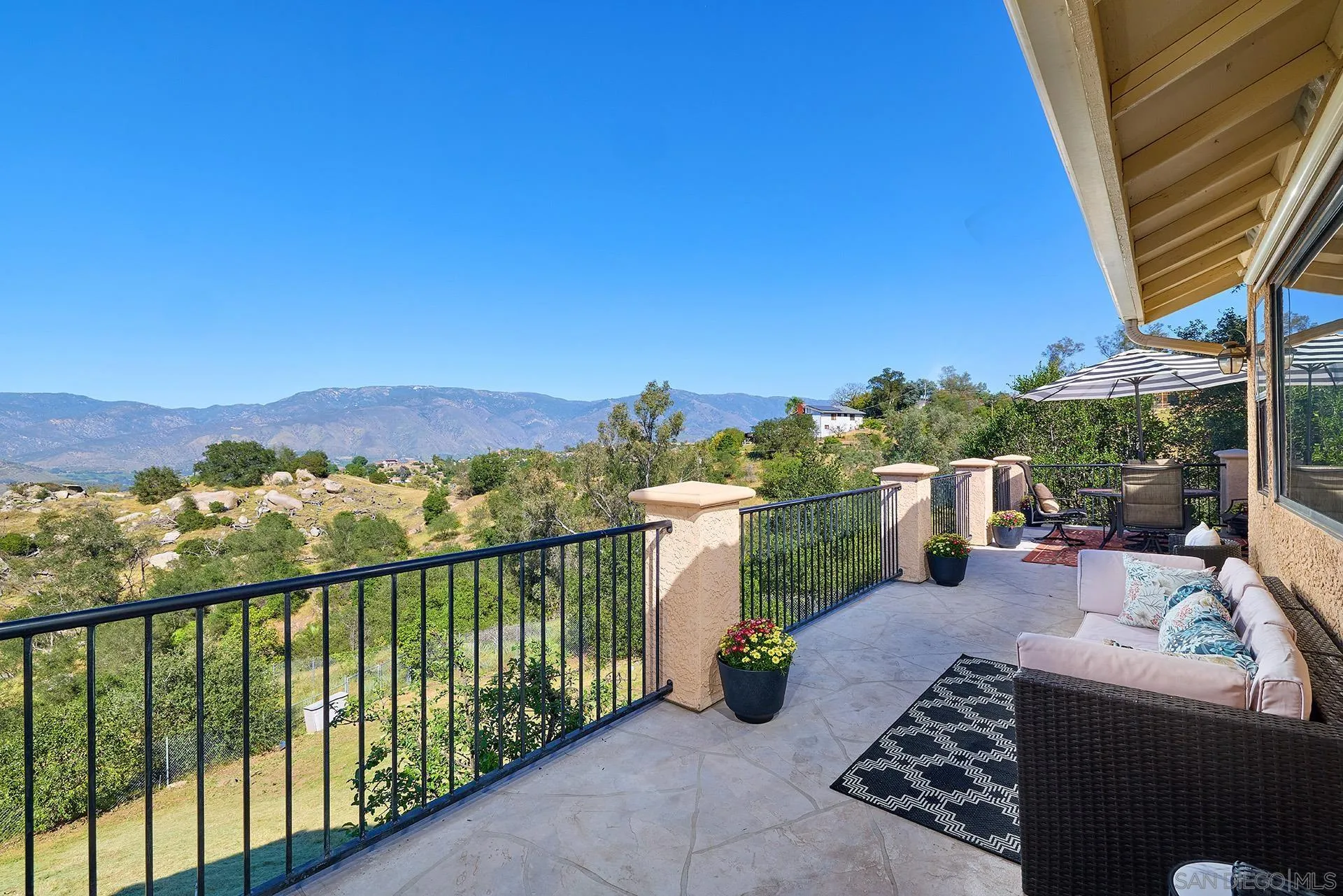 13588 McNally Road Valley Center, CA 92082 - Photo 24 of 43 a view of a balcony with two chairs and a table