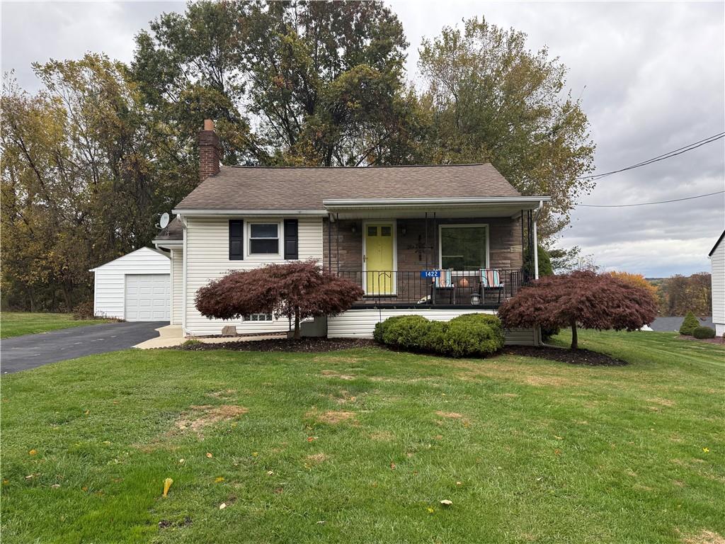 a view of a house with backyard porch and sitting area
