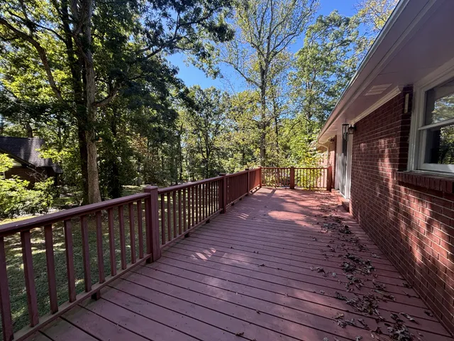 a view of a pathway of a house with wooden fence