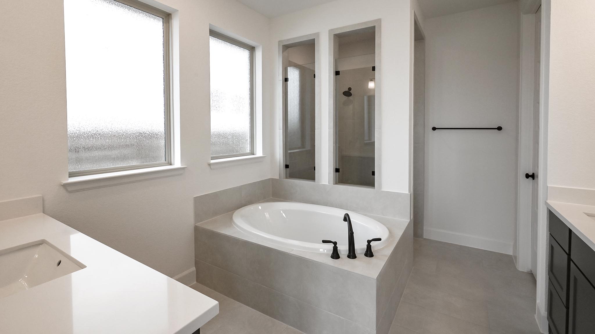 3921 Melody Road Lockhart, TX 78644 - Photo 14 of 30 a bathroom with bathtub and window