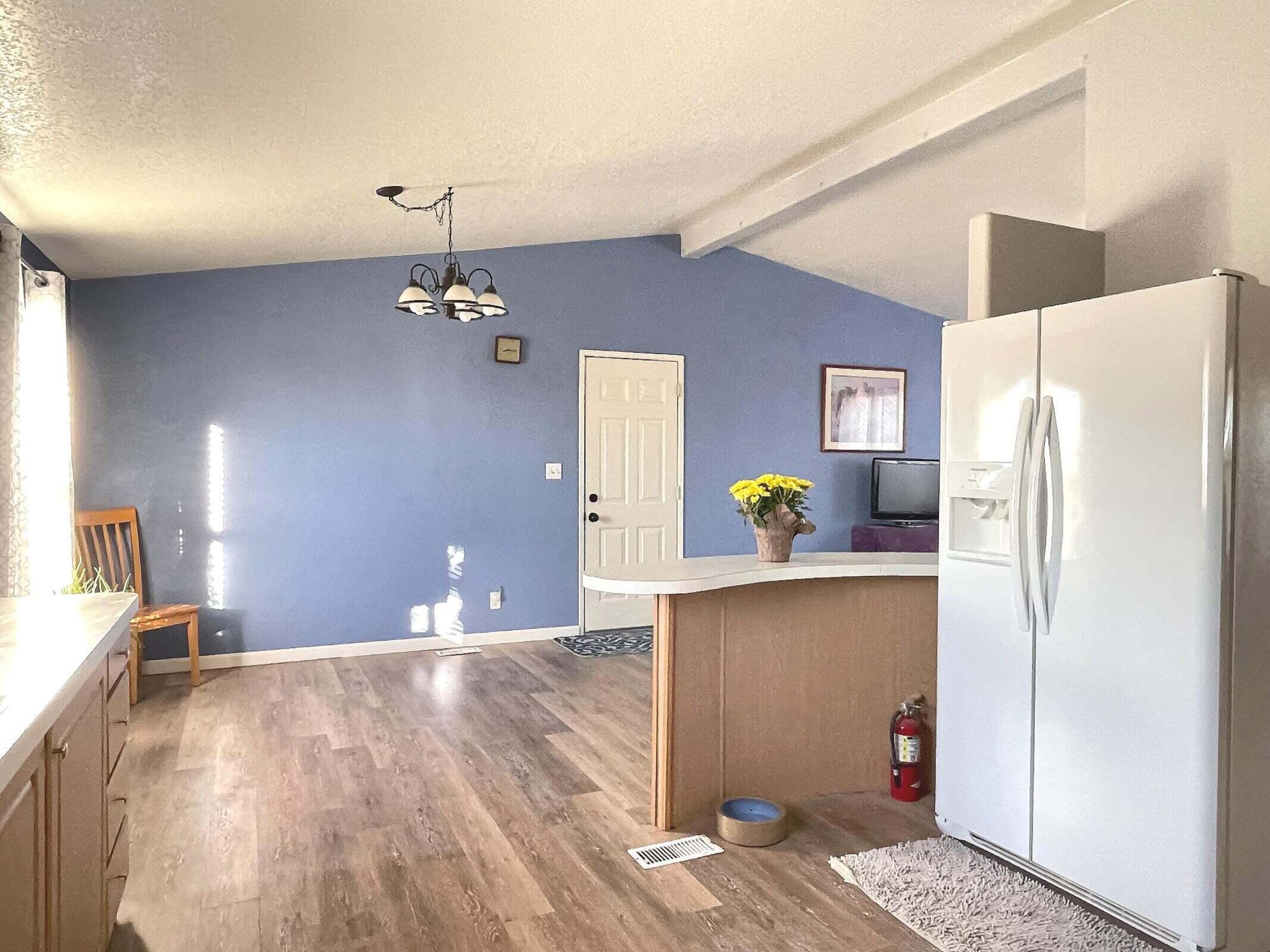 2285 Backus Road Mojave, CA 93501 - Photo 7 of 35 a kitchen with stainless steel appliances a refrigerator and a stove top oven